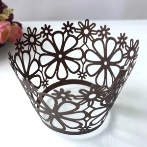 Dark brown laser-cut sunflower cupcake wrappers for elegant wedding cake decoration