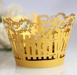 Laser-cut floral vine and bird silhouette golden cake wrapper for dessert table decoration