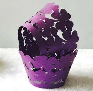 Detailed laser-cut purple clover pattern cupcake wrapper with handle for party decor