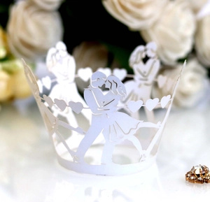 Elegant white laser cut cupcake wrappers with romantic kissing couple and heart silhouettes