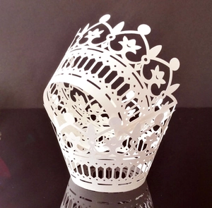 White laser-cut crown muffin wrapper with intricate floral hollow lace for wedding decor