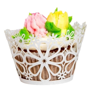 Elegant white laser-cut floral cupcake wrappers with intricate hollow petal design