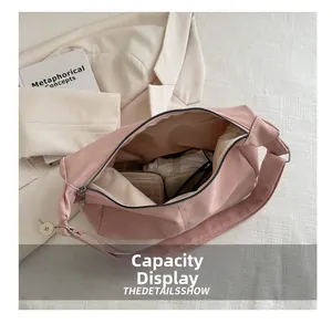 Top-down view of a pink minimalist crossbody bag showing large storage capacity
