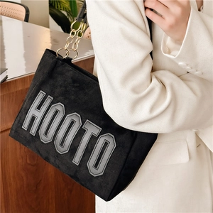 Black velvet tote bag with HOOTO letters and gold chain shoulder strap for women