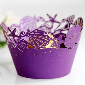 Purple laser-cut cupcake wrapper with ocean sea shells and starfish hollow pattern