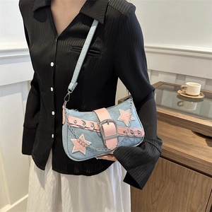 Denim star-patch shoulder bag with pink faux leather trim and silver chain strap