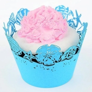 Sky blue laser cut cupcake wrappers with hollow seashell and starfish patterns