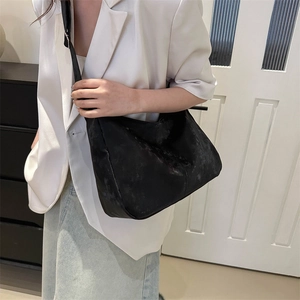 Minimalist black suede-textured hobo bag with contrast strap for casual wear