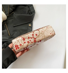 Detailed embroidery of plum blossoms on champagne silk satin evening clutch bag