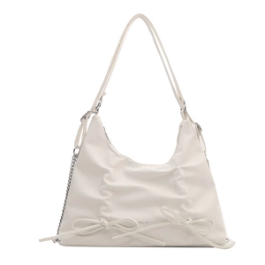 Elegante borsa tote beige con fiocco e tracolla a catena per moda primaverile