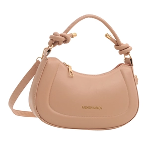 Minimalist hobo shoulder bag in nude pink with knotted handle and fashion gold text