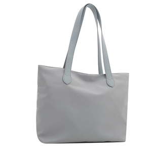 Minimalist grey-blue nylon tote bag with long shoulder straps on a clean white background