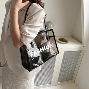 Trendy transparent PVC tote bag with Fashion text and black inner pouch for women