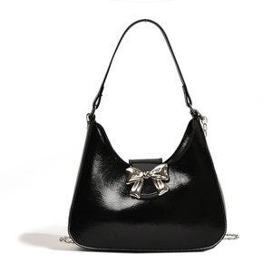 Fashionable black hobo bag with glossy finish and silver metal bow decoration