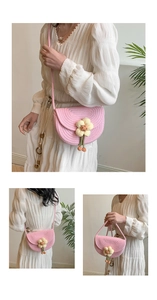 Detail of pink woven cotton crossbody bag with floral pattern and braided shoulder strap