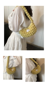Detail view of bright yellow bubble texture fabric shoulder bag with LOVE FASHION label