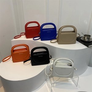 Minimalist crossbody small square bags in six colors with semi-circular handles and straps