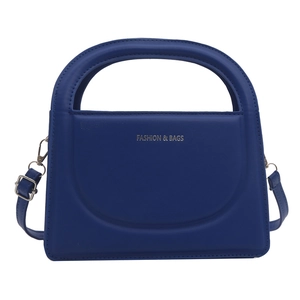 Minimalist royal blue crossbody handbag with gold fashion lettering on smooth leather
