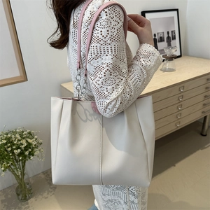 Stylish large capacity color-block tote bag with pink handles and metal chain detail
