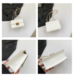 Detailed views of white quilted crossbody bag with heart pattern and gold chain strap