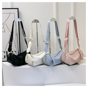 Detailed view of large retro pillow bags in black, white, blue and pink colors
