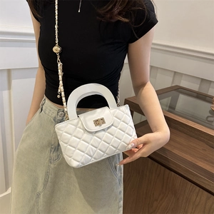 White quilted crossbody bag with gold chain strap and top handle for women