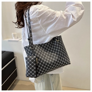 Detail of printed tote bag with geometric floral pattern and matching small coin purse