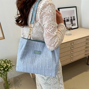 Minimalist light blue pleated tote bag with golden chain and leather straps for women
