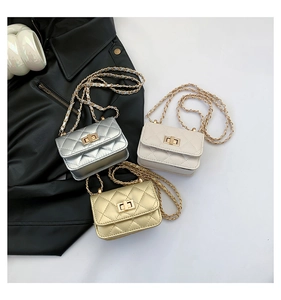 Detailed close-up of quilted mini bags in gold, silver, and beige with metal chain straps
