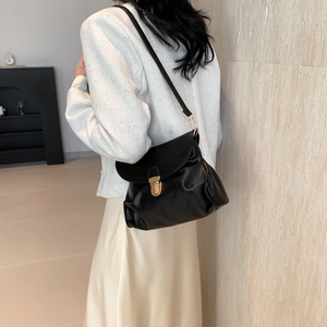 Elegant black pleated hobo bag with gold buckle for women in a casual street style