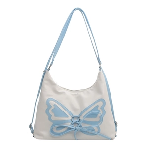 Women's stylish blue and white shoulder bag with large butterfly patchwork design