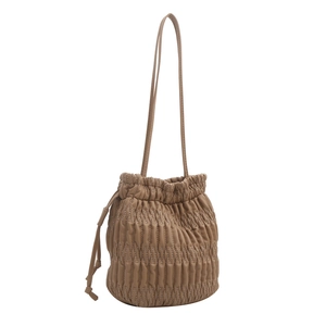 Brown drawstring bucket bag with vertical pleats and white wavy contrast stitching