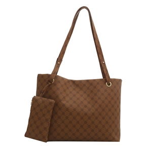 Brown monogram large tote bag with matching pouch and golden hardware on white background