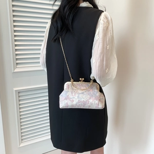 Elegant jacquard frame bag with metal handle and gold chain strap for women