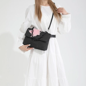 Black denim star shoulder bag with frayed edges and chunky chain strap for women