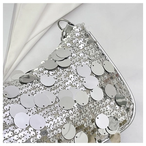 Close-up of sparkling silver sequins and mesh detail on this stylish shoulder handbag