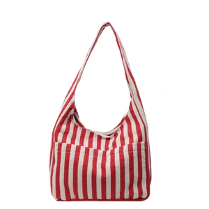 Classic red and white striped canvas tote bag with an outer pocket on a white background