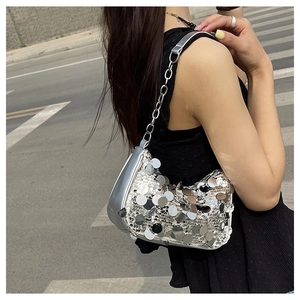 Silver sequin hobo bag with large round discs and a metallic chain shoulder strap