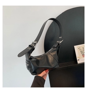 Detailed view of black semi-moon hobo bag with wide strap and silver buckle