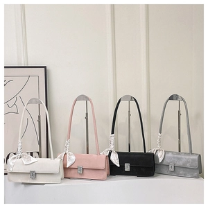 Detailed comparison of four underarm bags in white, pink, black, and gray with silk scarves