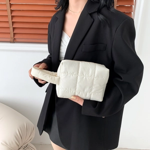 Minimalist cream quilted cotton tote bag with padded handles for women in summer