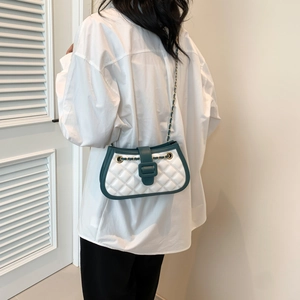 Quilted crossbody bag for women with green and white stitching and gold chain strap
