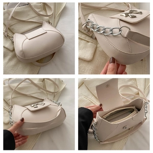 Dettagli della borsa in similpelle crema con fiocco argentato e catena in metallo lucido