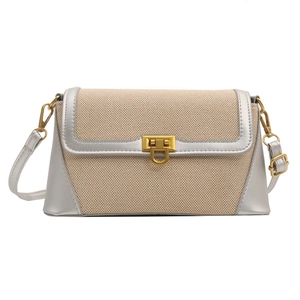 French baguette shoulder bag with beige canvas, silver leather trim and gold lock