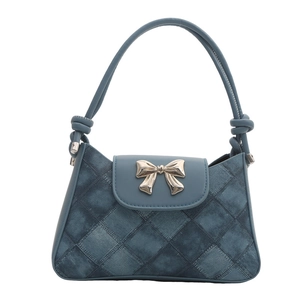 Chic foggy blue denim patchwork shoulder bag featuring a silver metal bow buckle