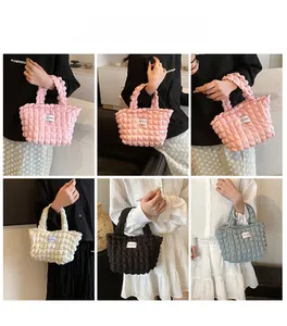 Detail shots of bubble textured tote bags in pink, beige, black and blue colors