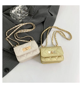 Detailed view of mini quilted flap bags with gold chain straps and metal turn-lock closures