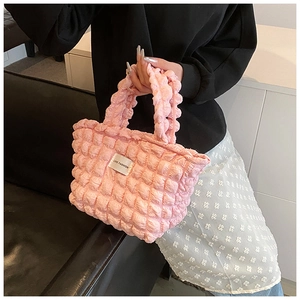 Detail of pink smocked bubble texture tote bag with Love Fashion label on front