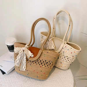 Chic straw tote bag with rainbow dots, pearl closure and lace bow for summer beach