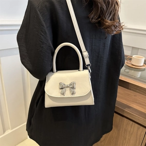 Chic beige bow handbag for women with silver metal bow and detachable shoulder strap